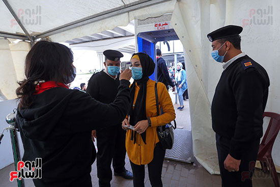 2021-08-29 Egypt polling station checking temperature of voters at security checkpoint 01
